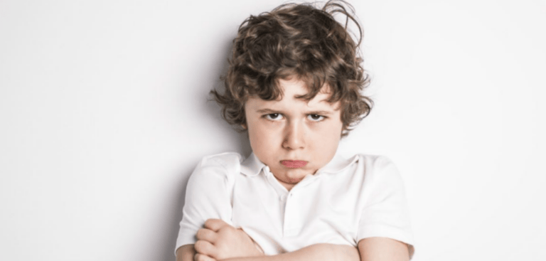 Behavior Therapy | curaJOY A young boy displaying behavior therapy techniques on a white background.