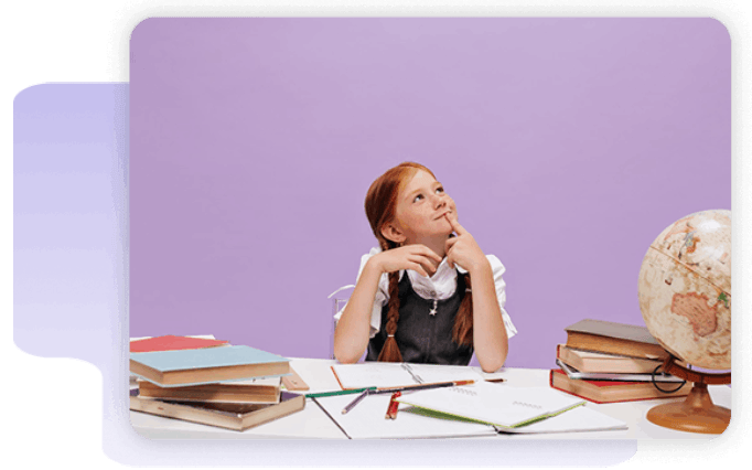 A girl sits at a desk with books, notebooks, and a globe, looking up thoughtfully against a plain purple background.